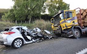 Collision between tractor-trolley and car