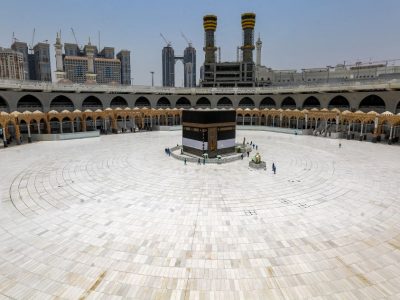 Workers at the Grand Mosque complex in Saudi Arabia's holy city of Mecca, mask-clad due to the COVID-19 coronavirus pandemic, work around the Kaaba, Islam's holiest shrine, at the centre of the complex ahead of the annual Hajj pilgrimage season on July 24, 2020. - The 2020 hajj season, which has been scaled back dramatically to include only around 1,000 Muslim pilgrims as Saudi Arabia battles a coronavirus surge, is set to begin on July 29. Some 2.5 million people from all over the world usually participate in the ritual that takes place over several days, centred on the holy city of Mecca. This year's hajj will be held under strict hygiene protocols, with access limited to pilgrims under 65 years old and without any chronic illnesses. (Photo by AFP)