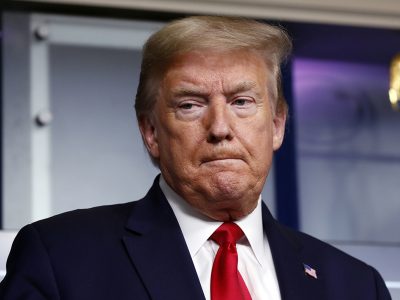 President Donald Trump listens as Agriculture Secretary Sonny Perdue speaks about the coronavirus in the James Brady Press Briefing Room of the White House, Friday, April 17, 2020, in Washington. (AP Photo/Alex Brandon)