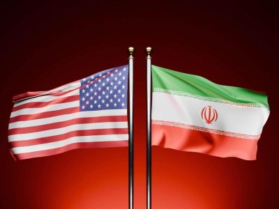 usa-vs-iran-observe-the-3d-rendered-flags-of-the-usa-and-iran-waving-on-opposite-sides-against-a-dark-background-with-a-cinematic-red-hue-video